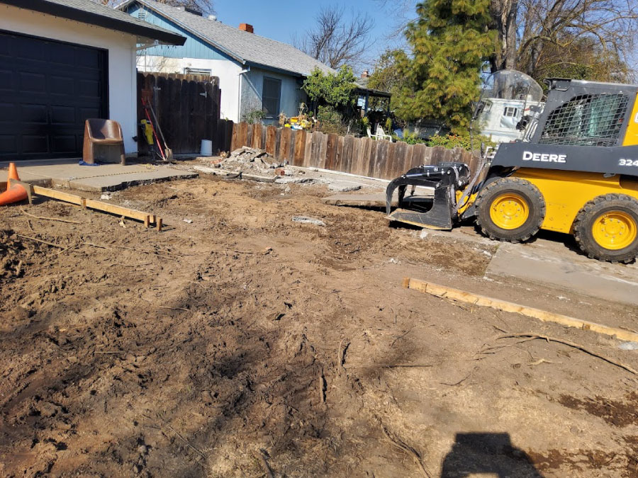 Leveling dirt driveway in preparation for pouring concrete