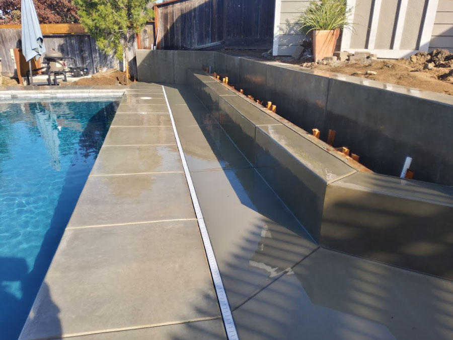 Concrete pool deck and garden bed